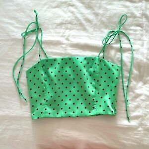 Cute green with small black polka dots crop top in satin material. Zip side